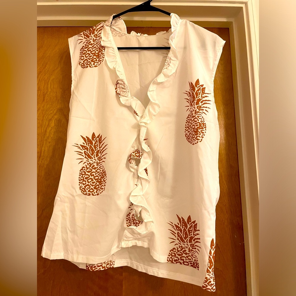 White ruffled blouse with gold pineapples